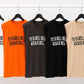 T-SHIRT CON SCRITTA E SPALLA IMBOTTITA