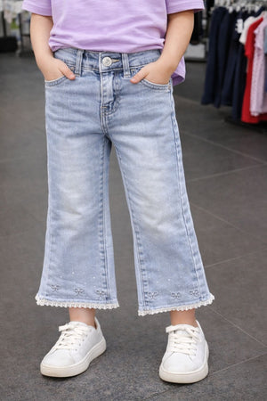 Jeans neonata con fiocchi